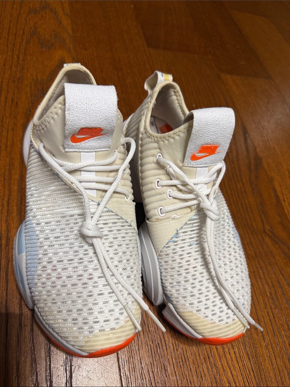 Nike Men’s White Knit Running Shoes with Orange Accents